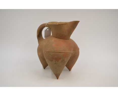 A Red Pottery Tripod Ewer, Neolithic period, Dawenkou culture, c. 4300-2400 BC Reference. For a similar red pottery tripod ew