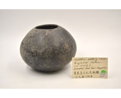 A Rare Black Pottery Jar. Neolithic period, Xiajiadian culture, 2nd Millennium BC. Clay black pottery, polished throughout. T