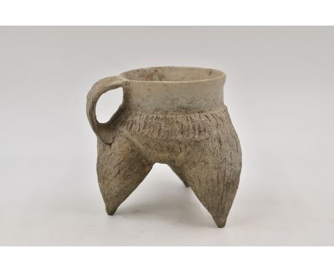 A Grey Pottery Tripod Vessel, Neolithic period, Longshan culture, c.?2500-2000 BC H:13cm