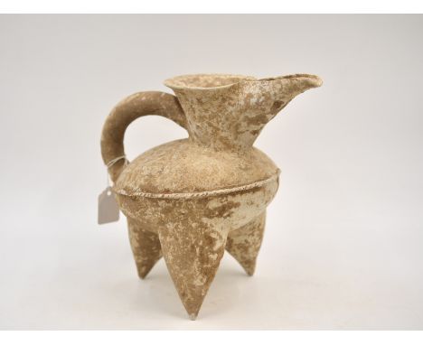 A White Pottery Tripod Ewer,Neolithic period, Dawenkou culture, c. 4300- 2400 BC Reference. For a similar red pottery tripod 