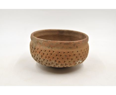 A Red Pottery Bowl with Pricked Designs, Neolithic period, Yangshao culture, Banpo phase, c. 4800-4300 B.C.Reference.For a si