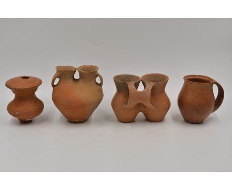 Four Small Red Pottery Vessels, Neolithic period, Qijia culture, 2050 - 1700 B.C.Reference.For A similar three red pottery ve