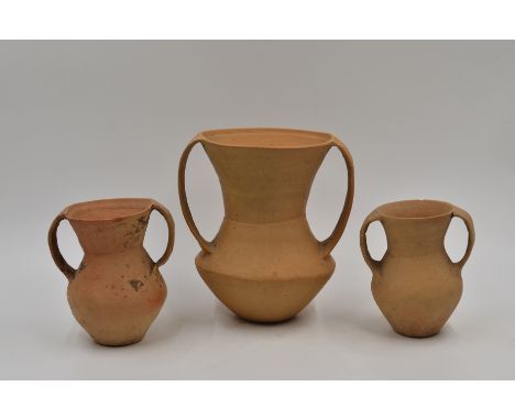 Three Red Pottery Handled Jars, Neolithic period, Qijia culture, 2050 - 1700 B.C.Reference.For three similar  red pottery ves