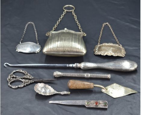 A collection of silver, silver plated and white metal pieces including an early 20th century silver handled button hook havin