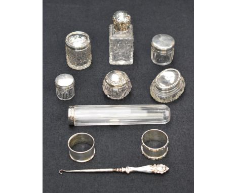 A selection of late 19th and 20th century silver mounted dressing table wares, including a cut glass scent bottle having and 