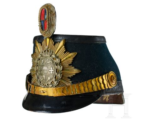 A shako for Mecklenburg Jaeger Battalion 14 Officers  Black felt covered body with black leather front and rear visors; gold 