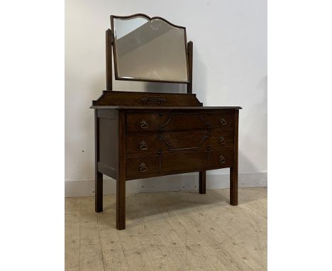 An early 20th centruy oak dressing chest, with swing mirror over three long drawers, on square supports, H150cm