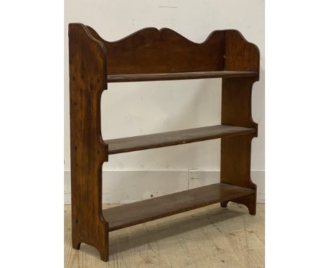 An Early 20th century mahogany three tier open shelf, standing on panel end supports, H72cm, W77cm
