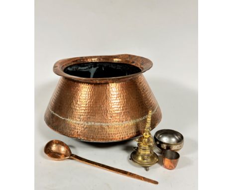 A group of Eastern copper and brassware including a copper flared rim and sided cooking pot with hammered finish, (h: 23cm x 