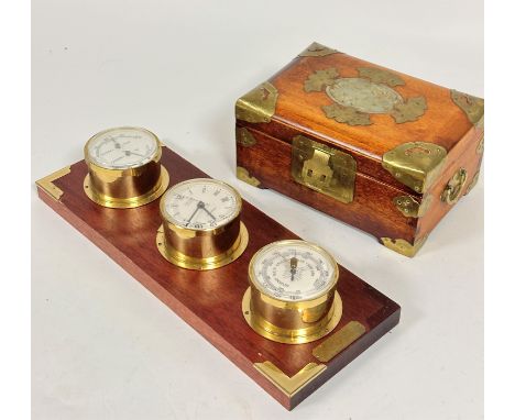 A Chinese hardwood brass mounted jewellery box with silk style lined interior with lift out tray and central jadeite pierced 