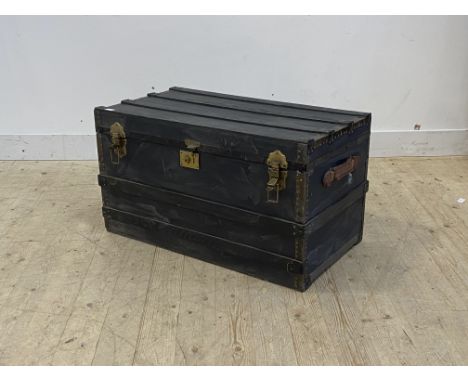An early 20th century wooden bound steamer trunk, The hinged top opening to a silk lined interior, with leather carry handle 