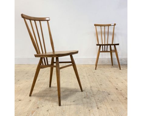 Ercol, A pair of Vintage beech and elm comb back dining chairs, each with shaped seats raised on turned supports, no label, H