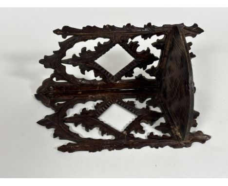 A Continental Edwardian folding pierced and carved wall corner shelf, (h 33cm x 22cm)