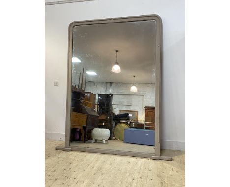 A monumental 19th century over mantel mirror, the moulded and arched frame with later grey paint enclosing period glass 210cm
