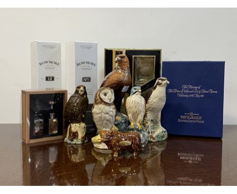 A collection of five Whyte and Mackay novelty whisky decanters by Royal Doulton, each modeled as a bird of prey, together wit