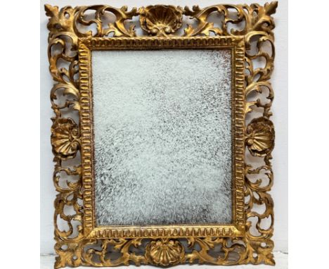 Florentine gilt framed wall mirror with shell and ivy leaf scrolling frame and fluted inner border, (56cm x 48cm) shows no si