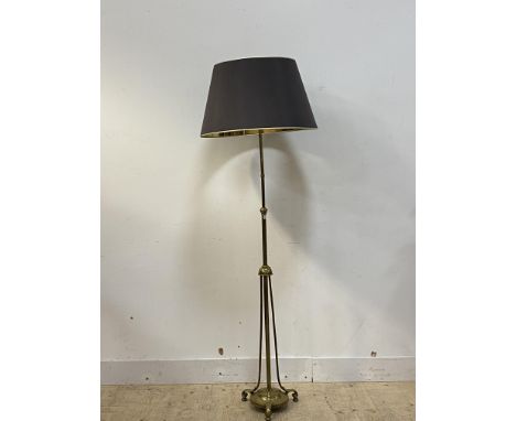 An Edwardian brass telescopic standard lamp, with three branches and raised on three scroll cast supports, together with a de
