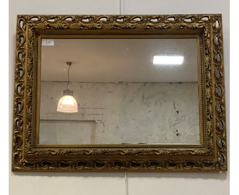 A floral moulded gilt framed wall mirror, 50cm x 66cm