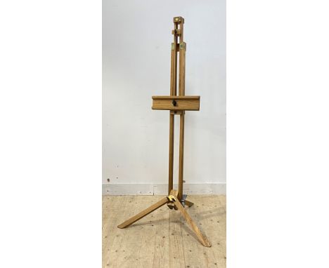 A large oak artists rise and fall folding easel, raised on a tripod base H171cm (Minimum)