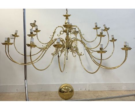 A large brass Dutch style chandelier with central column issuing eighteen scrolled branches D167cm