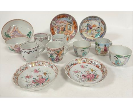 A pair of Chinese export late 18th early 19thc tea bowls decorated with figure of a lady seated in garden with pine trees and