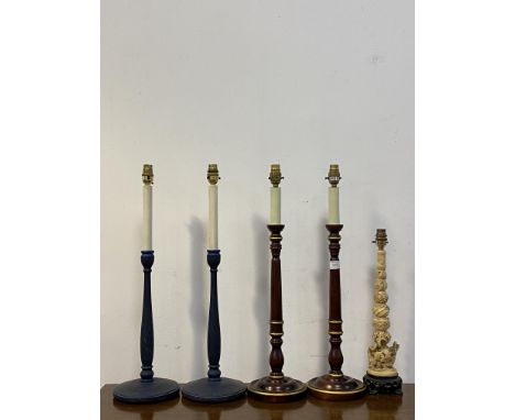 A pair of parcel gilt and stained turned beech table lights formed as candle sticks (H63cm) together with a pair of blue pain