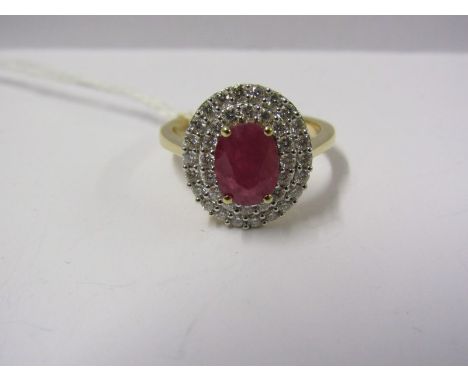 18ct YELLOW GOLD RUBY &amp; DIAMOND CLUSTER, Principal oval cut ruby measuring in excess of 1ct surrounded by well matched br