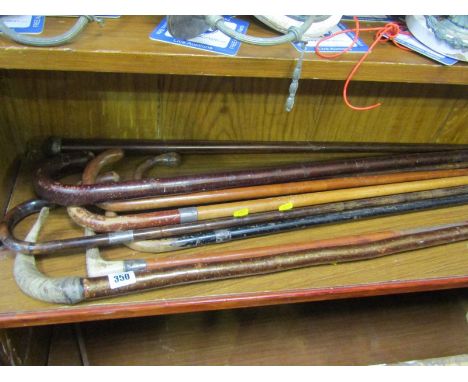 WALKING STICKS, 8 assorted walking sticks some with silver ferrules, an antler handled riding crop, horn handled stick etc 