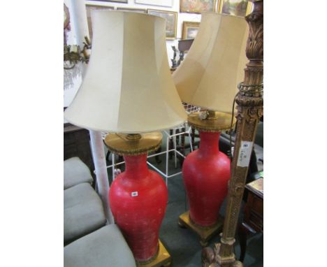 LIGHTING, an impressive pair of red painted baluster vase floor lamps, gilt brass fittings with shades, 60" height 