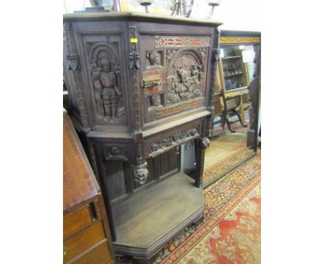 FLEMISH CARVED CABINET, quality carved oak narrow cabinet with Medieval style carved panels and metalwork with open shelf bas