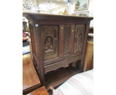 ANTIQUE COURT CUPBOARD, an oak framed cupboard the front doors with carved lion &amp; figure decoration, fitted 2 lower drawe