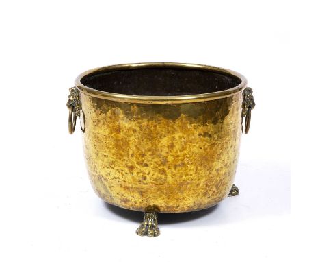 A 19th century brass log bin with lion's mask ring handles and three paw feet49cm diameter x 37cm high Qty: 1Usual surface de