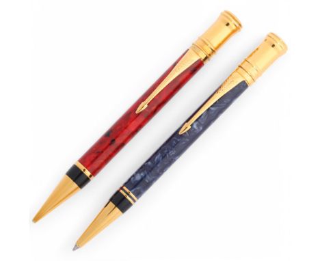 A Parker Duofold Classic Centennial mechanical pencil with Jasper red body marked 11Y, and a similar Parker Centennial Ballpo
