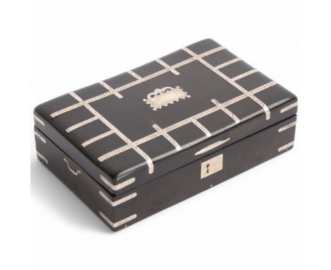 A mid-19th century French tortoiseshell table snuff box in the form of a trunk, circa 1840, with inlaid silver decoration and