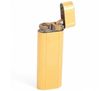 A Cartier gold plated cigarette lighter, serial no. D82117, 7cm longUntested, no flint, dents to top corners some surface mar