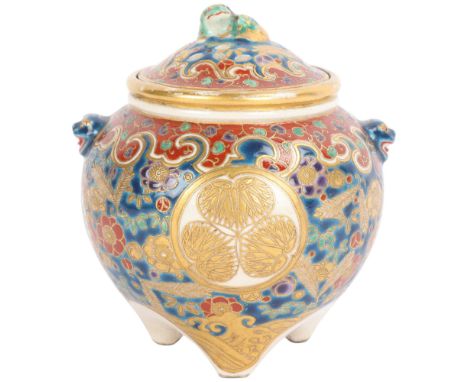 A Japanese Satsuma porcelain pot pourri pot and cover, brightly coloured painted and gilded decoration, surmounted by a Dog o