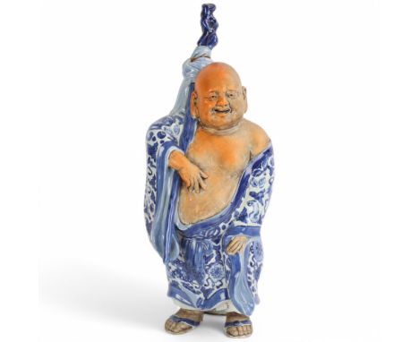 A Chinese porcelain decanter in the form of a standing figure with blue and white robes, height 44cm Good condition, no chips
