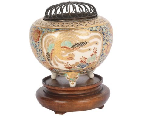 A Japanese Satsuma porcelain pot pourri pot, with bronze cover, signed under base, height 10cm, diameter 10cm, on wooden stan