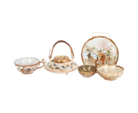A small group of Japanese Satsuma porcelain, including a teapot with painted storks, diameter 12cm, a small finely painted an