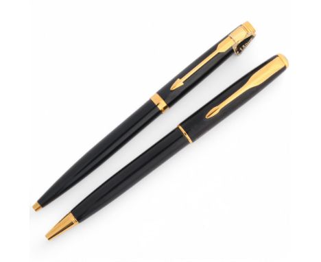 A Parker SenatorSonnet ballpoint pen together with a slimline Parker ballpoint pen, both with black lacquer bodies and gilt d