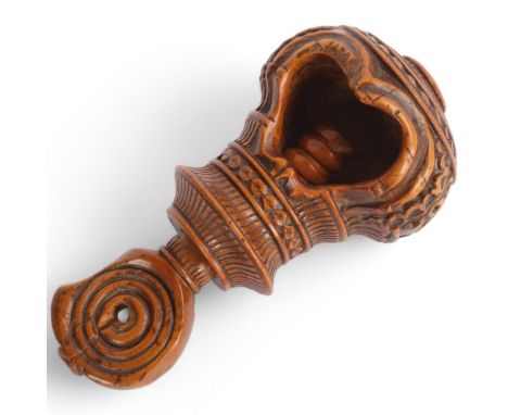 A 19th century carved treen nutcracker, length 11cmGood condition, general wear through handling and use