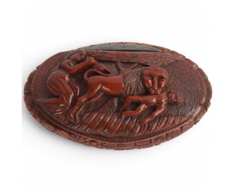 A 19th century coquilla nut snuff box, high relief carved lid depicting a lion attacking a man, length 7.5cmGood condition
