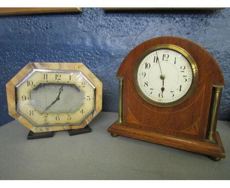 Two early 20th century mantle clocks, an inlaid mahogany mantle clock with open brass columns and ball feet, and an Art Deco 