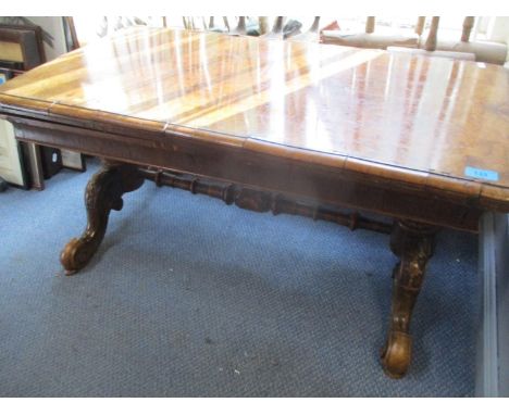 A Victorian quarter cut, walnut veneered card table being reduced in size to form a coffee table A/F 