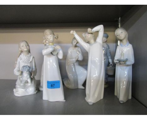 A group of Nao and Lladro porcelain figurines 