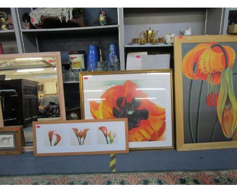 A group of three prints depicting lilies, one of a triptych of lilies after Bill Philip, another print of a male leopard, and