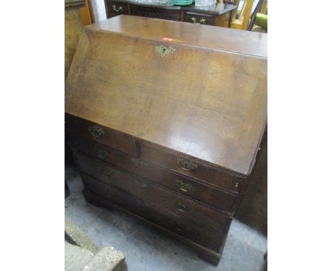 A George III mahogany Estate bureau, the fall flap with fitted interior, central pigeonholes flanked by short drawers, two sh