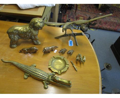 A group of brass ornaments to include an alligator nut cracker, Timson Bros ashtray, eagle with outstretched wings and others