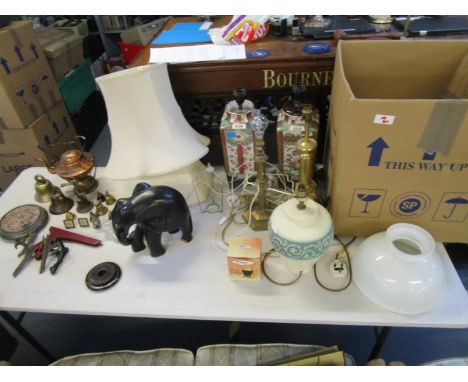 A mixed lot of table lamps, one with fabric shade, a ceiling light with milk glass shade, mixed brass ware to include tea bel