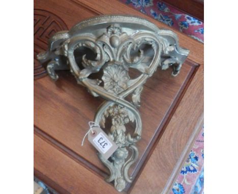 A gilded corner shelf.